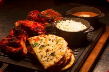 Order Spicy Chicken Tikka Masala! Naan Bread, Curries and more! Start your order online!