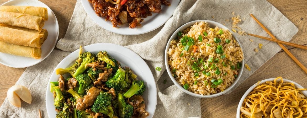 A selection of Chinese takeaway dishes served on a table