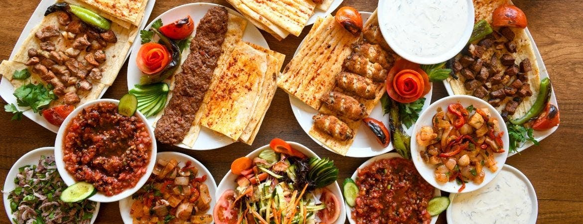 A selection of grilled kebab dishes served on a table