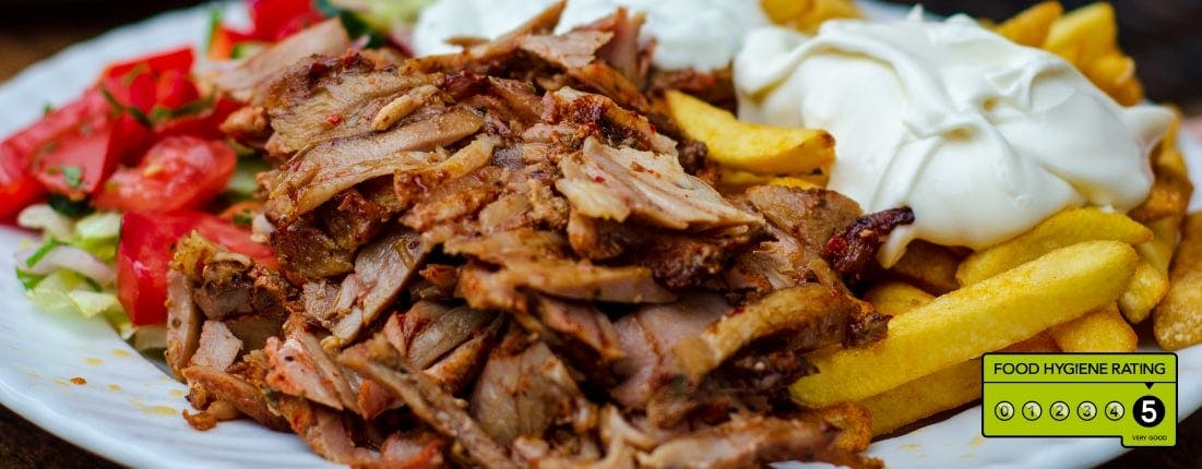 Kebab, fries with garlic mayo, and salad