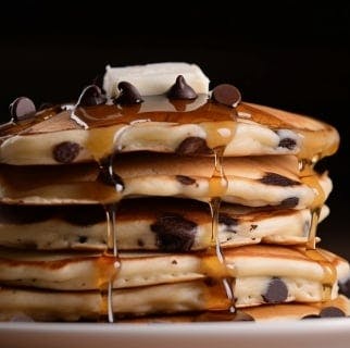 Chocolate pancakes served with honey and butter from Perico Dessert Box (Tipton)