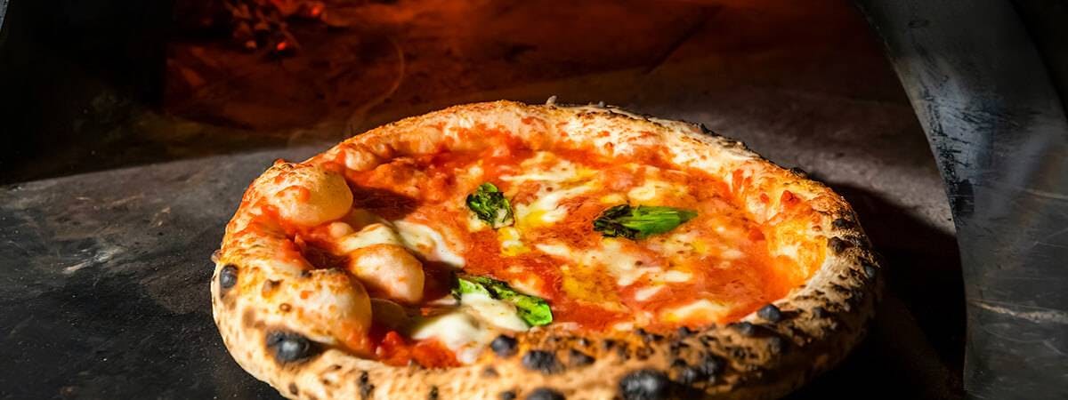 Authentic wood fired pizza available for collection or delivery from Pizzaholics