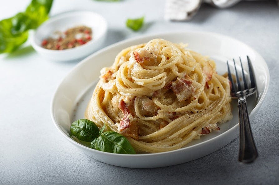 Order a freshly made carbonara from Pizzaholics (Kingston upon Thames) today