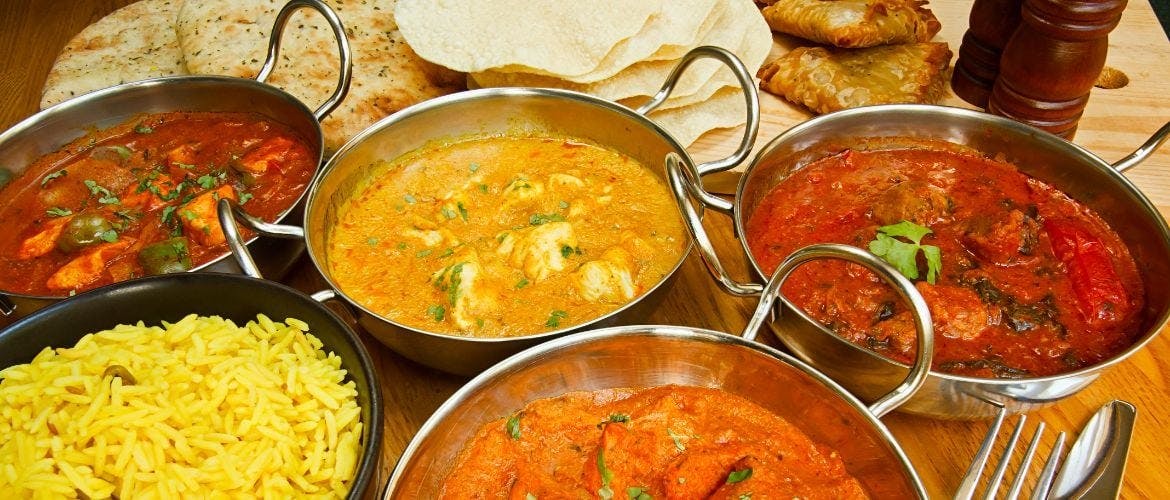 A selection of the curries available at our Indian Restaurant and Takeaway in Melksham, served with rice and bread.