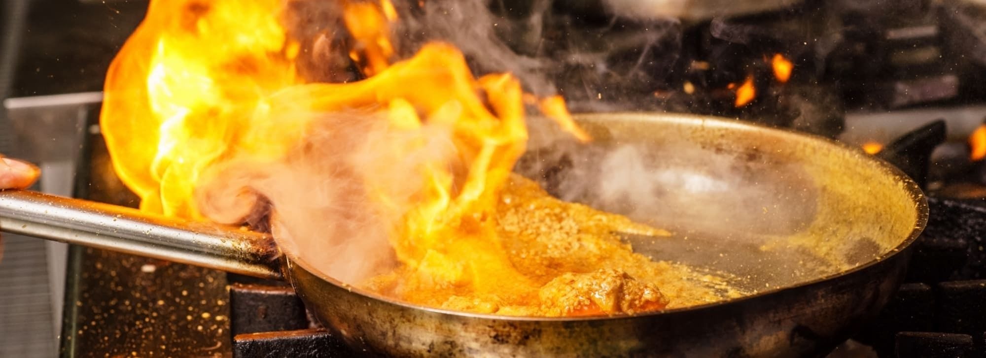 The chefs at our Indian Takeaway in Fairford preparing an authentic dish