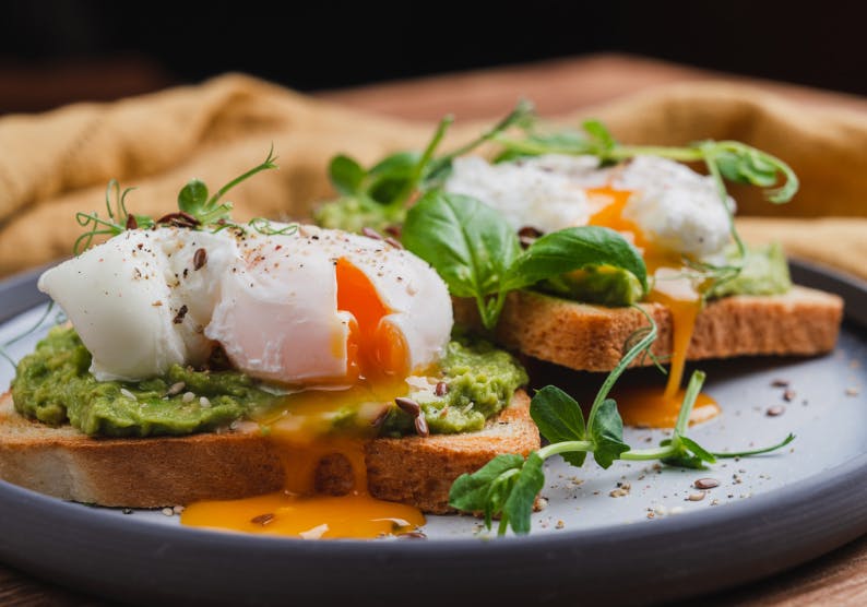 Poached egg and avocado on toast from the online menu at Finches Cafe