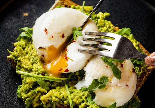 Poached egg and avocado on toast from the menu at Finches Table Ordering