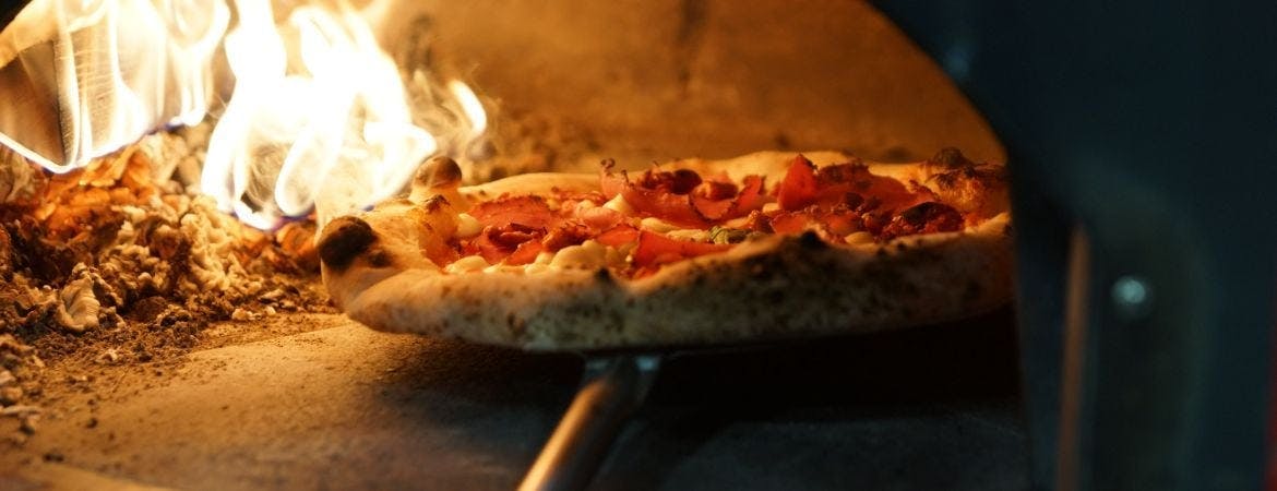 Order authentic oven-cooked pizza online for delivery or collection from Basil Pizza