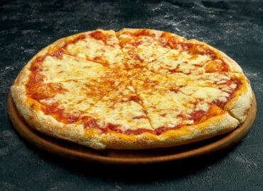 Order a freshly cooked pizza from the tempting menu available at PizzaX (Leicester)