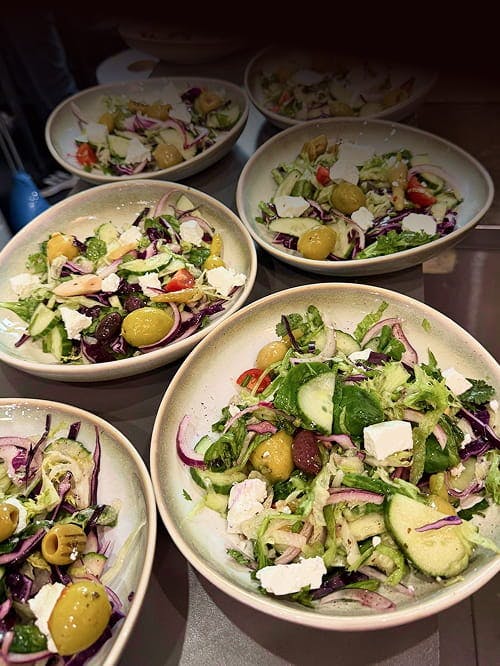 Salad dishes prepared at Khyber Shinwari in Slough