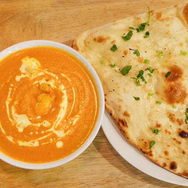 Order delicious classic curries and sides at The Fiery Grill and Curry!