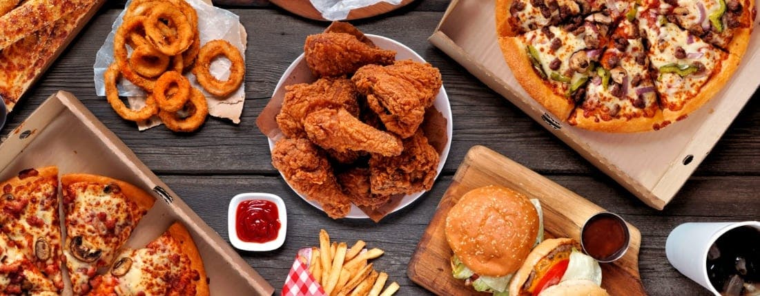 Fried Chicken, Burgers, Pizzas, Onion Rings, Fries and Coke